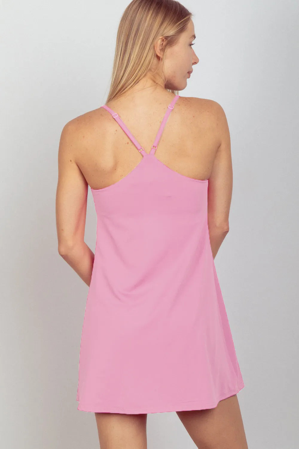 Mauve sleeveless active tennis dress by Trendsi with built-in unitard liner, designed for sport and athletic wear.