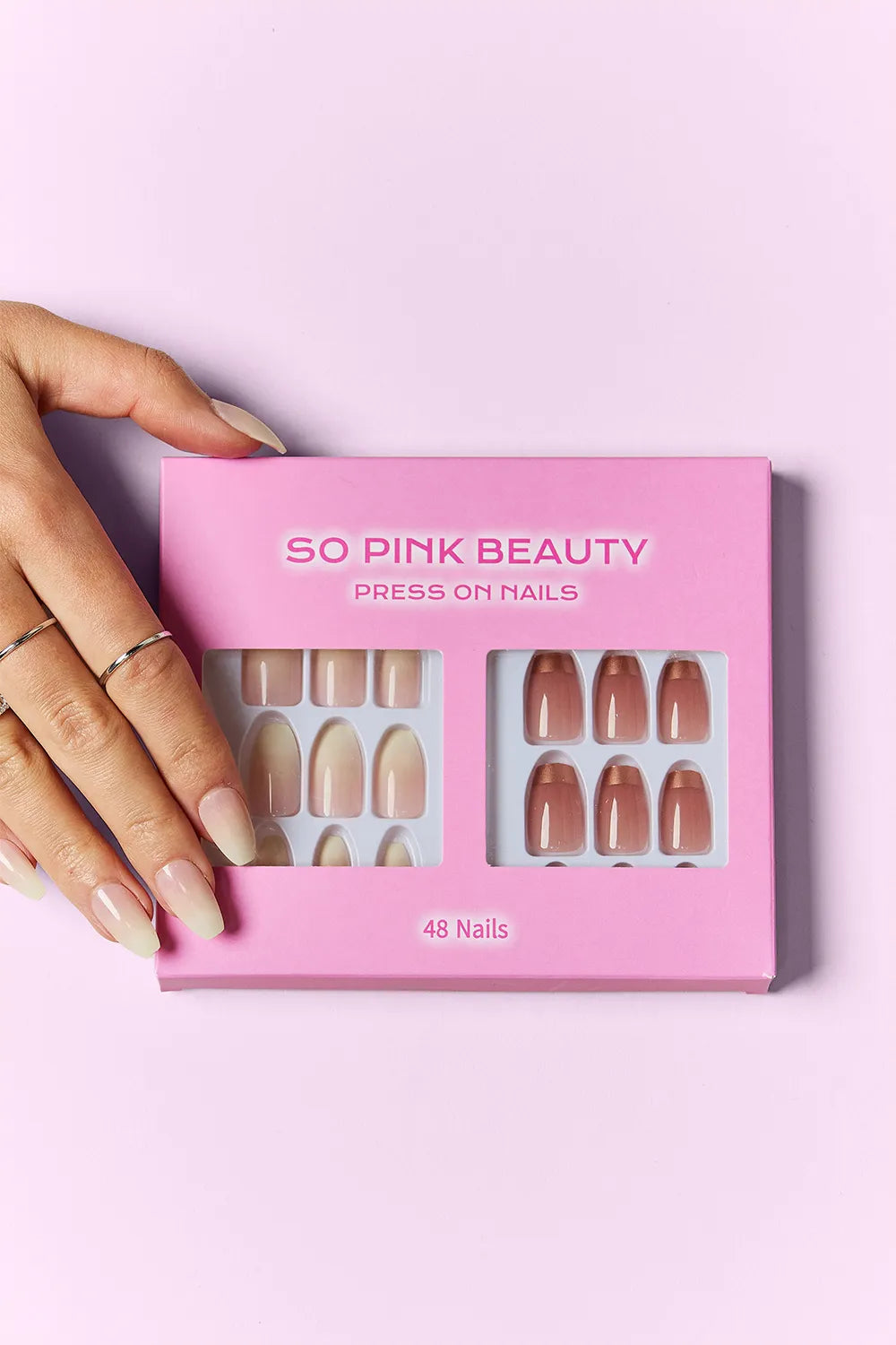 Trendsi SO PINK BEAUTY press-on nails in two packs, featuring stylish pink nail designs on a natural-looking set.
