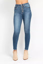 Plus size Judy Blue skinny jeans with high-rise fit and button fly, featuring a classic denim look and full-length style.