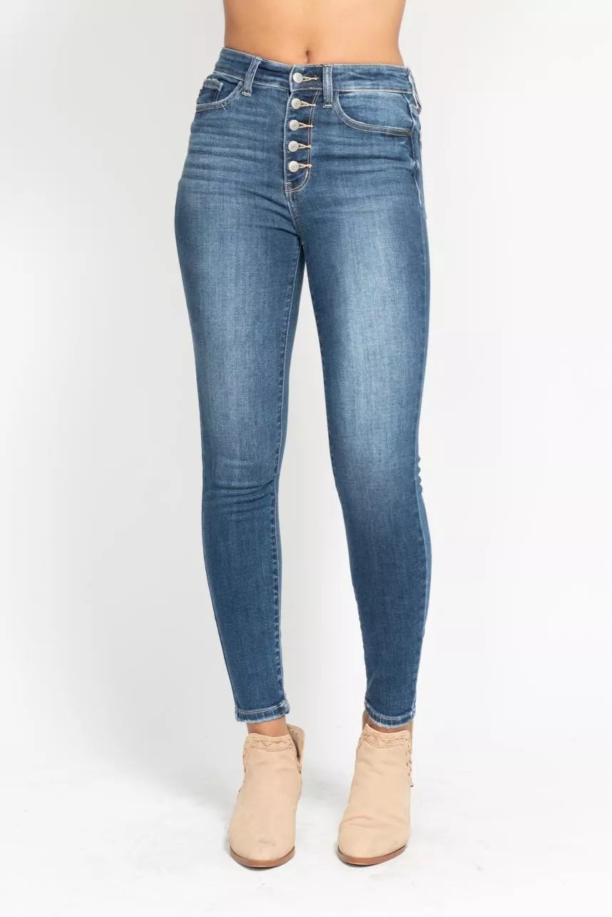 Plus size Judy Blue high-rise skinny jeans with button fly, full length, showcasing denim texture and fit.