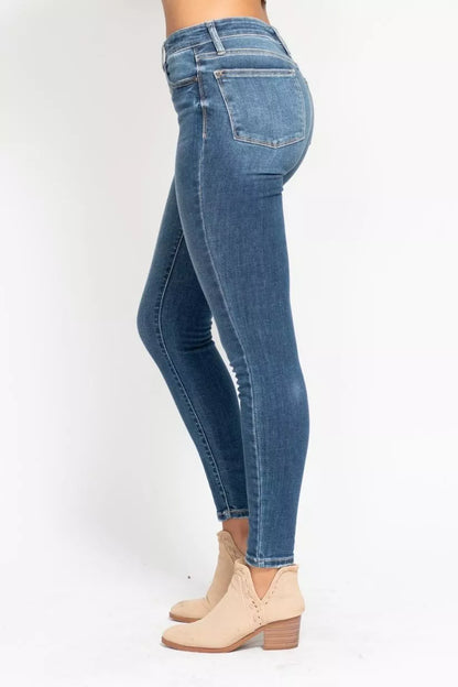 Plus size Judy Blue high-rise skinny jeans with button fly, full length, and classic denim look on a model.