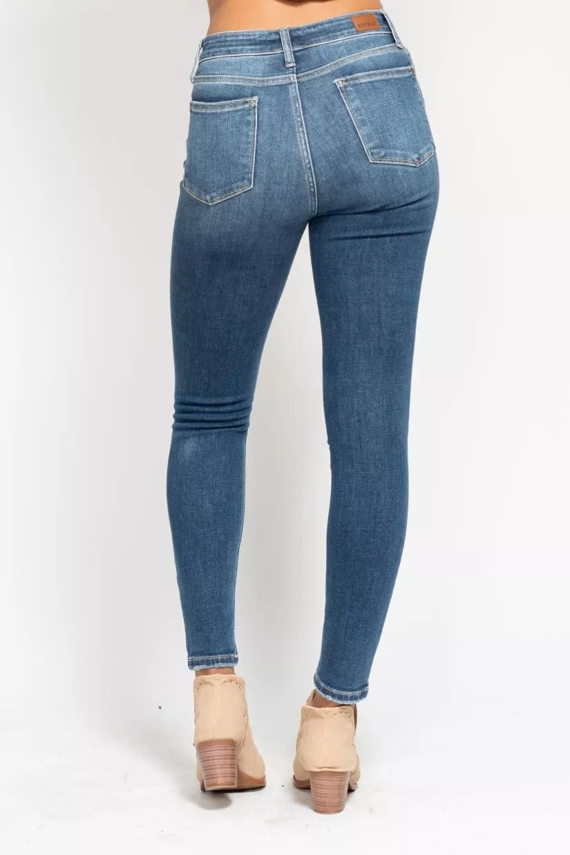 Plus size Judy Blue high-rise skinny jeans with button fly, featuring a full-length fit and classic denim style.