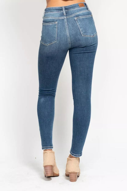 Plus size Judy Blue high-rise skinny jeans with button fly, featuring a full-length fit and classic denim style.