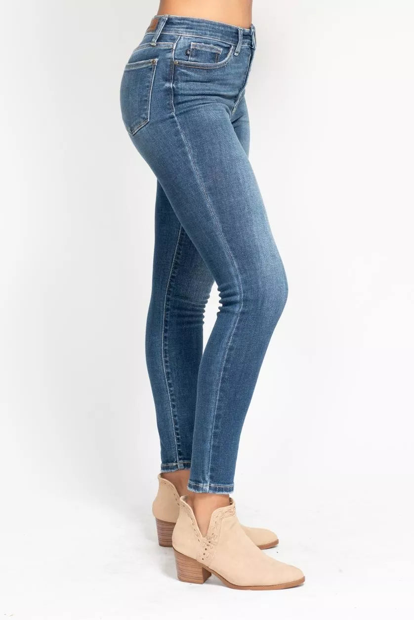 Plus size Judy Blue high-rise skinny jeans with button fly, casual fit, in denim, featuring a full-length design and classic style.