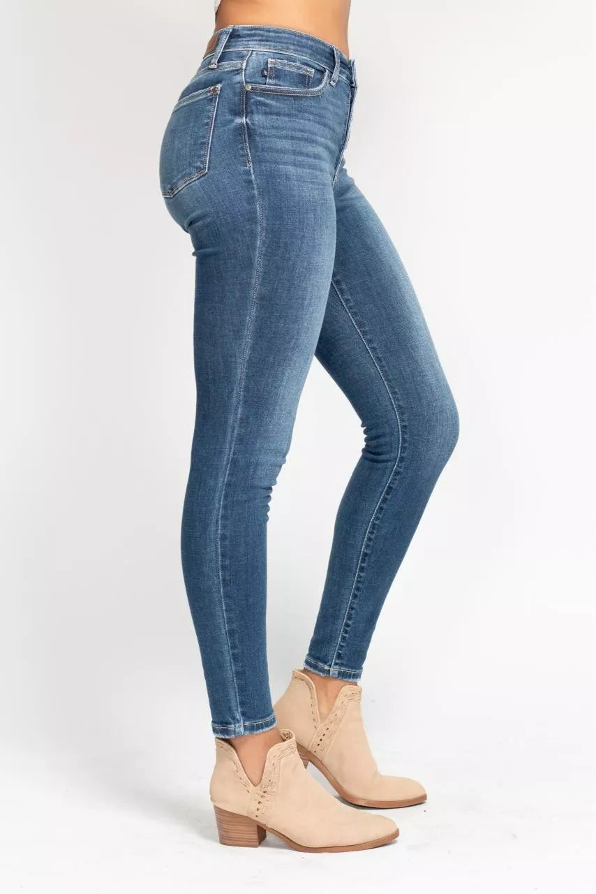 Plus size Judy Blue high-rise skinny jeans with button fly, full size, trendy denim pants shown on model.