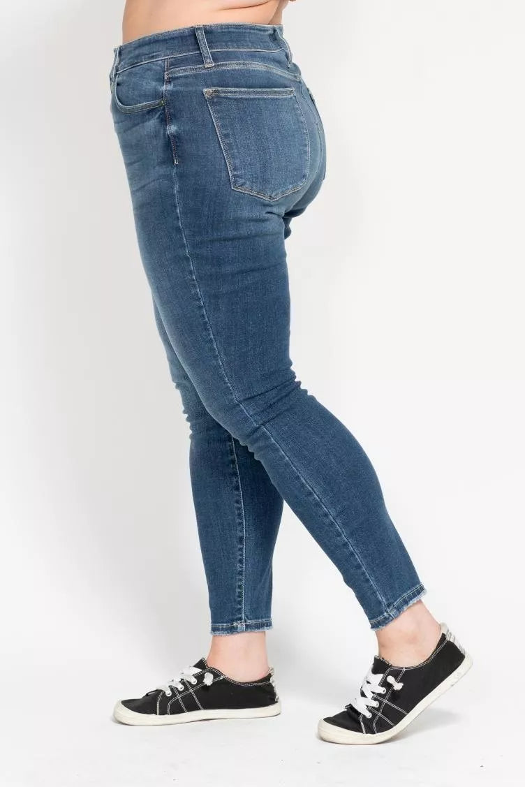 Plus size Judy Blue high rise skinny jeans with button fly and classic denim look, styled for a flattering fit.