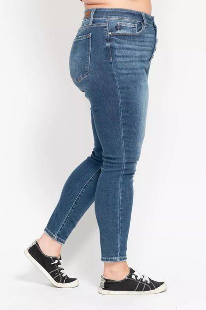 Plus size Judy Blue high rise skinny jeans with button fly, full-length denim pants featuring a trendy, fitted silhouette.