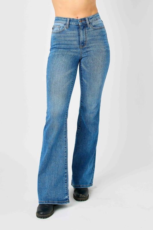 Plus size Judy Blue high-waisted classic flare jeans, full length, denim fabric, stylish fit, shown on a model.