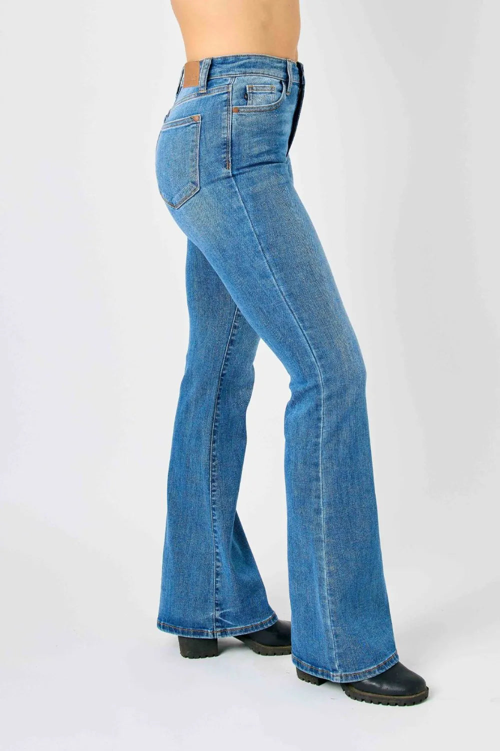 Plus size Judy Blue high-waisted classic flare jeans with a full-length fit and stylish design, displayed on a neutral background.