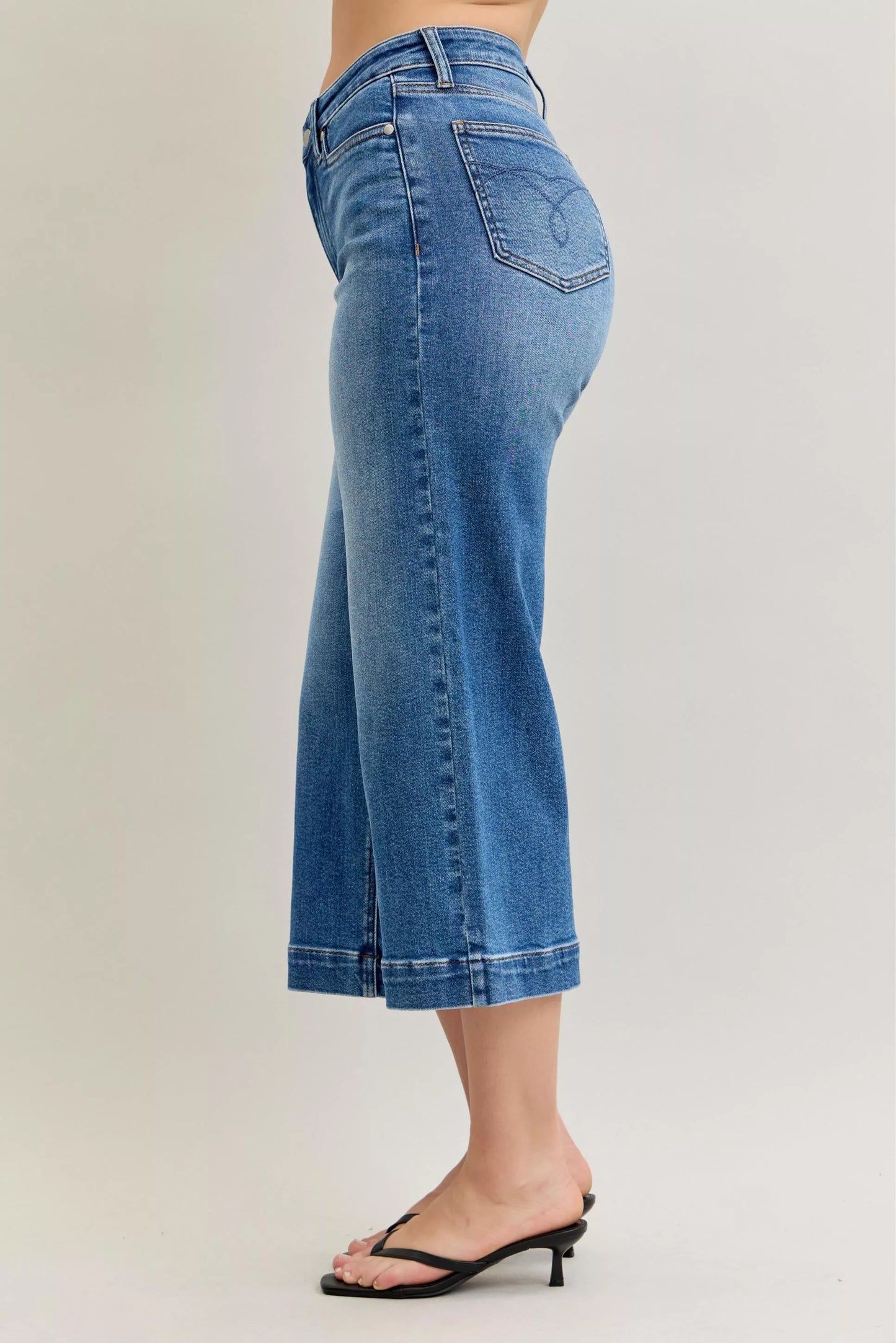 Light blue Judy Blue mid-rise crop wide-leg jeans featuring a classic denim look and relaxed fit, perfect for casual wear.