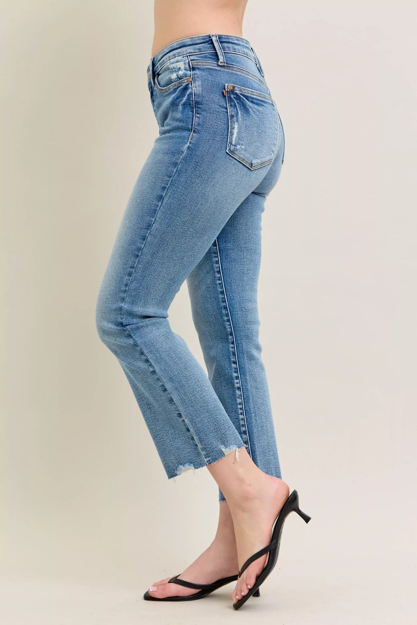 Judy Blue Mr Vintage Wash Destroy Hem Kick Flare Jeans with distressed details and flared legs, styled for a casual look.