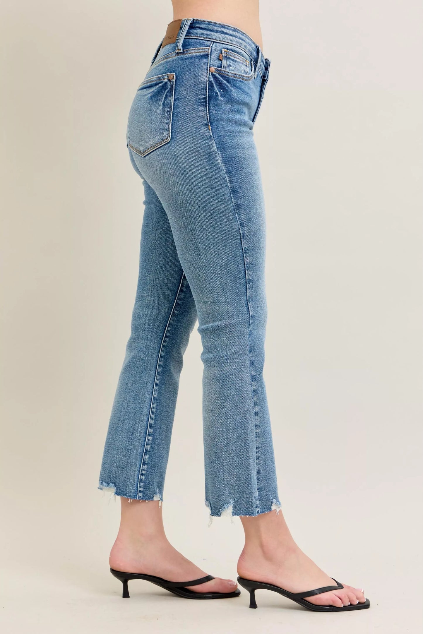 Judy Blue Mr Vintage Wash Destroy Hem Kick Flare Jeans showing distressed hem, high-waisted fit, and vintage wash fabric detail.