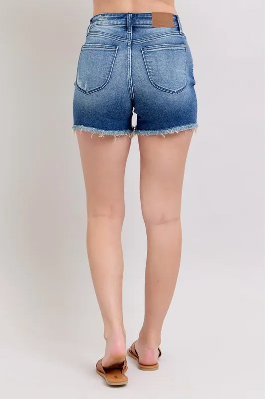 Full size Judy Blue V-front denim shorts with shield pockets, plus size, featuring a stylish design and classic denim texture.