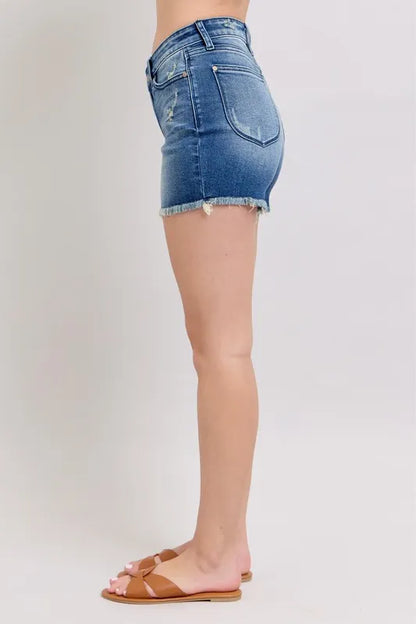 Plus size Judy Blue V-front denim shorts with shield pockets, showcasing a stylish fit and classic denim look.