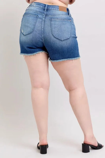 Plus size Judy Blue V-front denim shorts with shield pockets, showcasing the stylish fit and design of these trendy denim shorts.