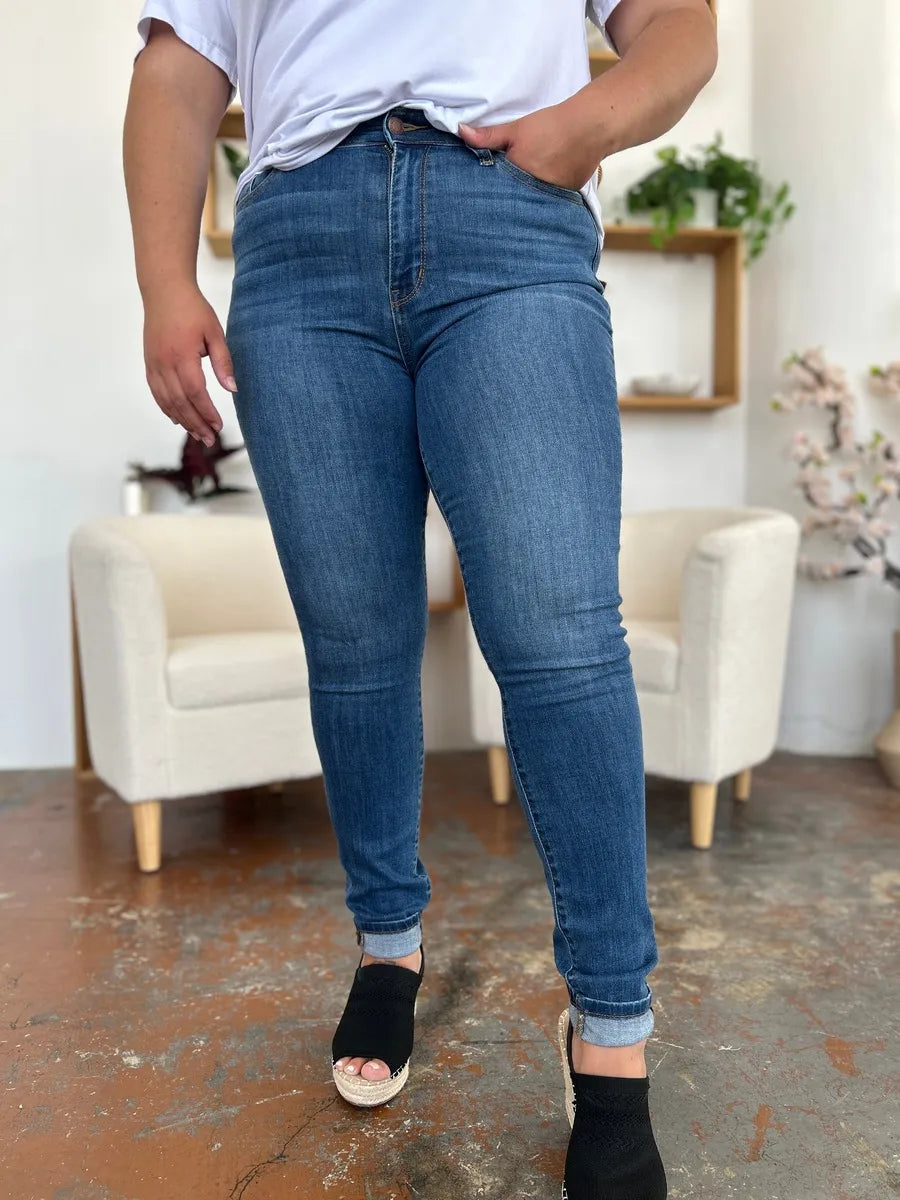 Full view of Judy Blue full-size cuffed hem skinny jeans with classic denim wash, styled on a model.