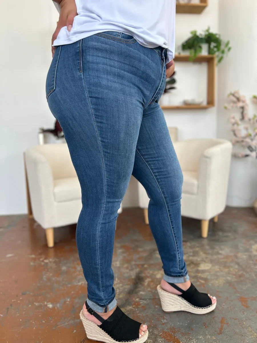 Judy Blue full-size cuffed hem skinny jeans in medium wash, showcasing fitted style and classic denim look.