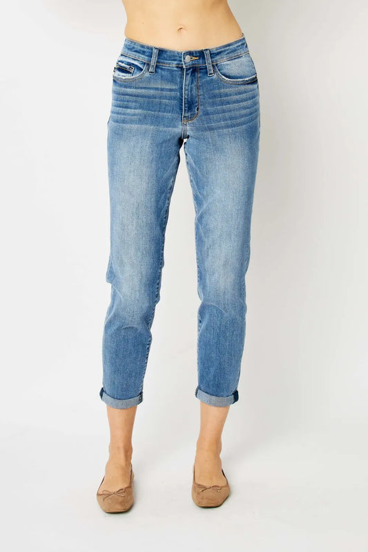 Full view of Judy Blue full-size cuffed hem slim jeans with classic denim wash, displayed on a hanger.