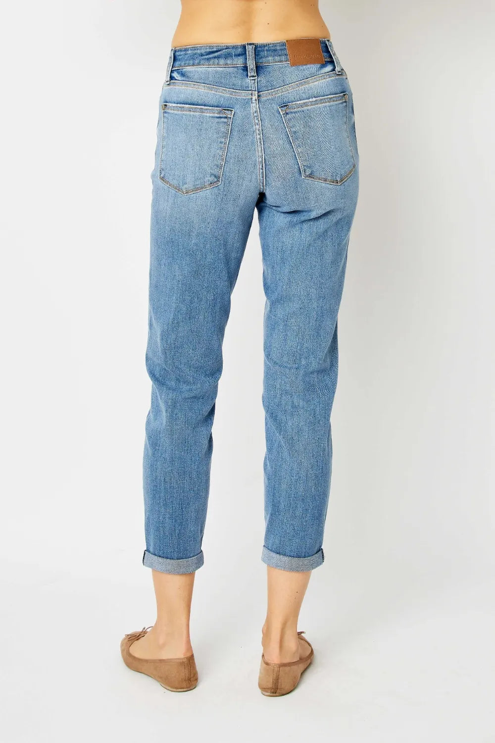 Full size Judy Blue slim jeans with cuffed hem, showcasing dark denim and classic fit, designed for a stylish casual look.