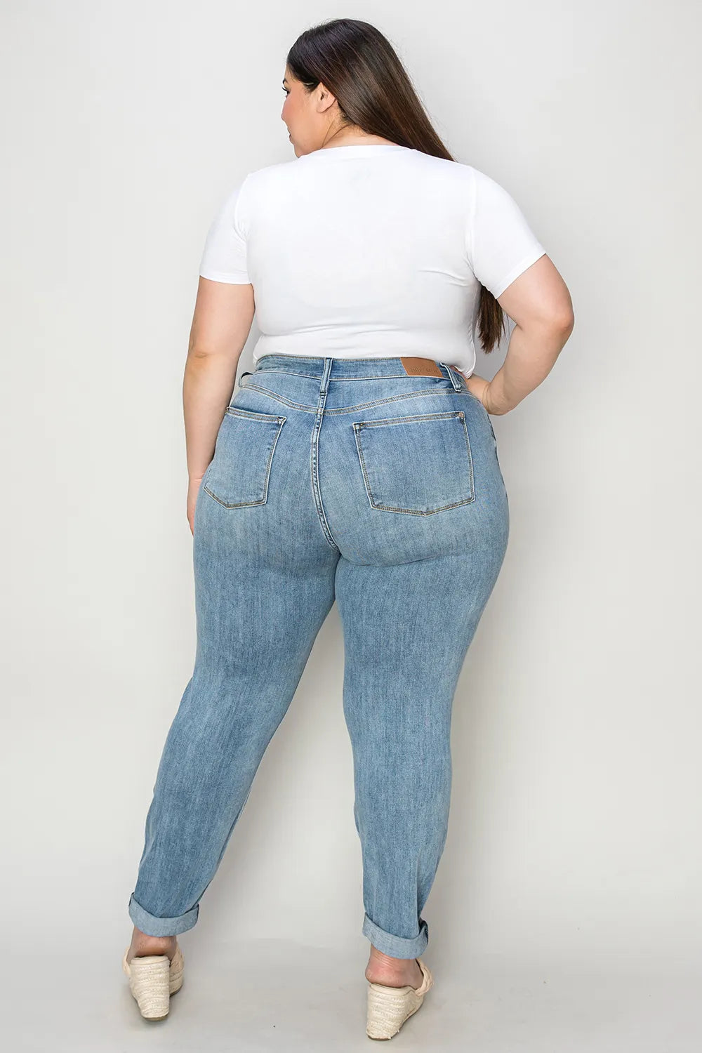 Full size Judy Blue cuffed hem slim jeans shown in medium wash with classic five-pocket style and fitted silhouette.