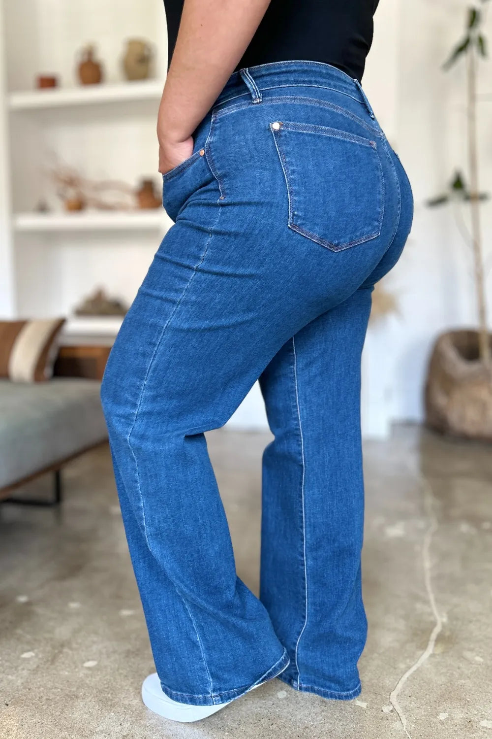 Medium shot of Judy Blue high-rise straight jeans showing fit and style, featuring classic denim wash and full-length design.