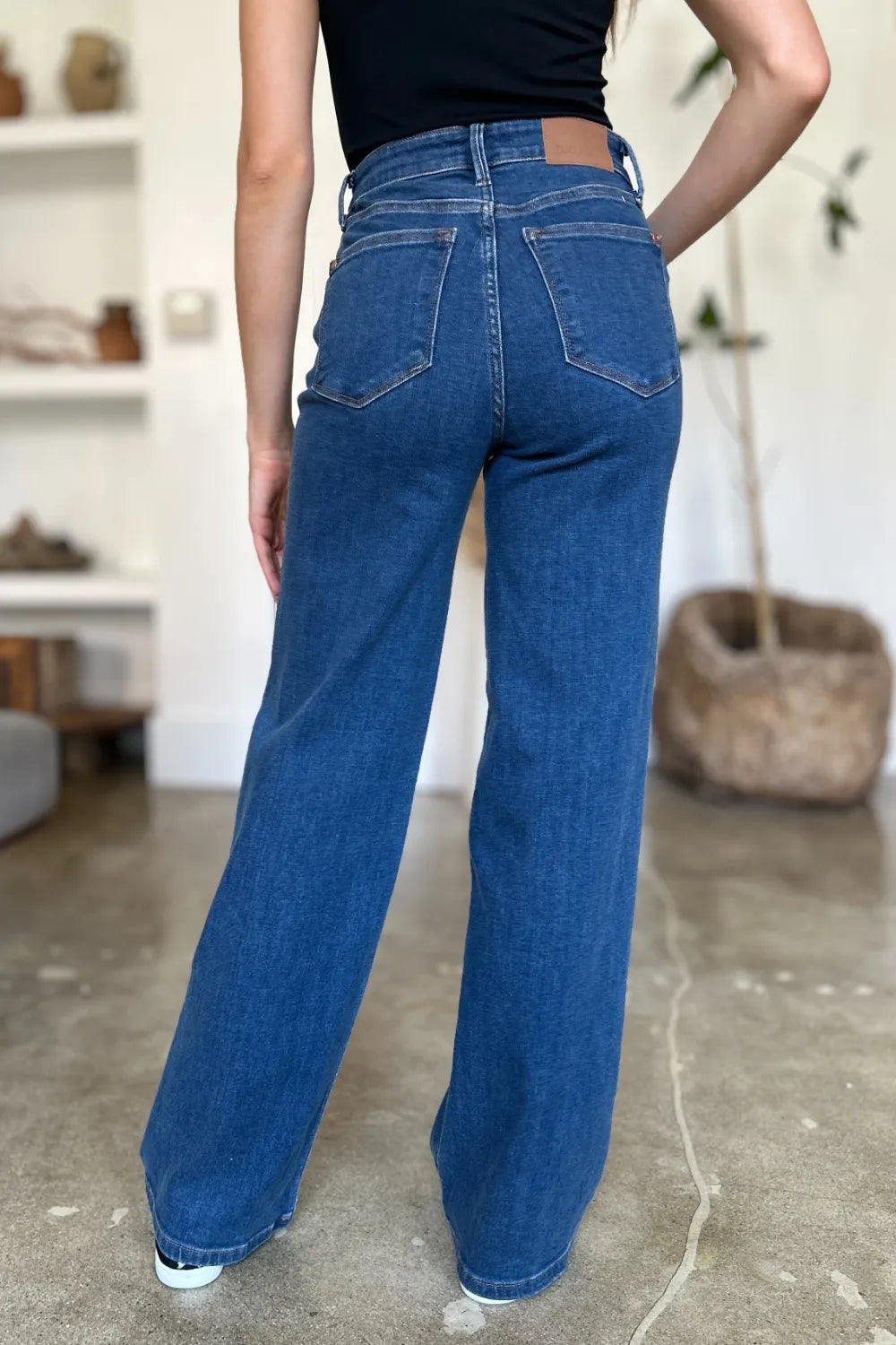 Medium shot of Judy Blue high-rise straight jeans showing fit and style, featuring classic denim wash and full-length cut.