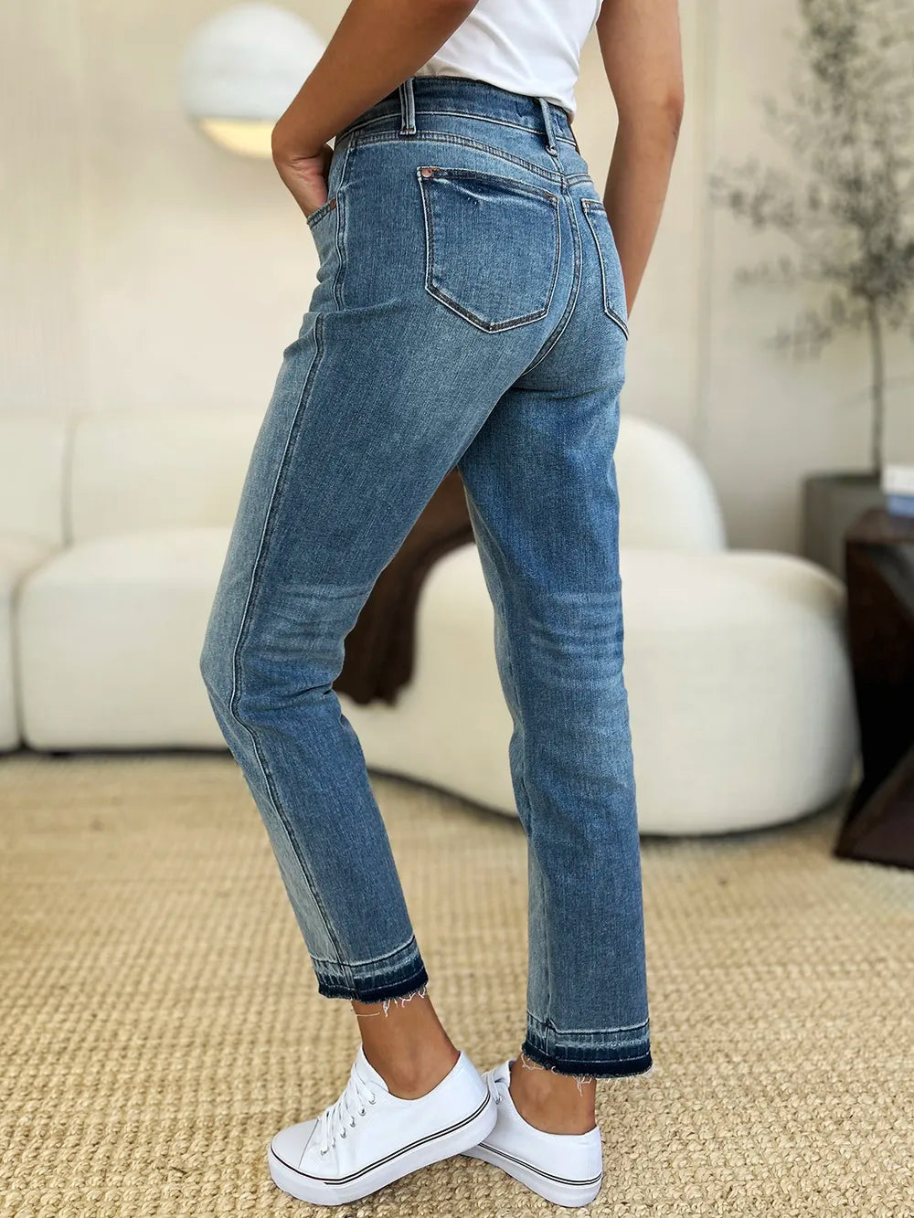 Judy Blue full size mid-rise rigid jeans with magic release hem, showcasing a classic denim look and trendy distressed details.