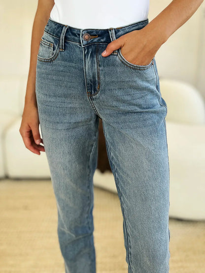 Judy Blue full size mid-rise rigid jeans with magic release hem, shown in a medium wash with classic five-pocket design.