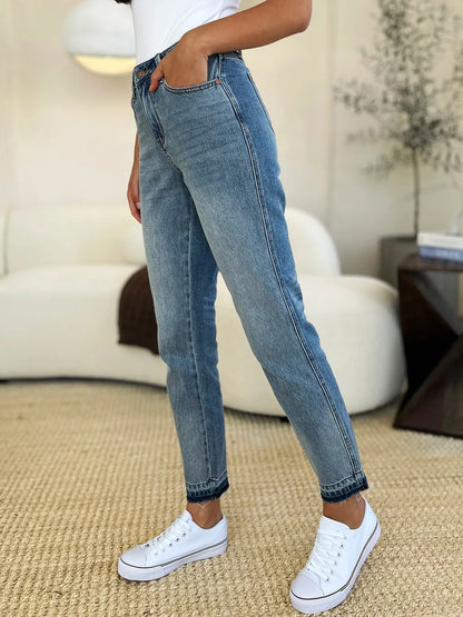 Judy Blue full-size mid-rise rigid jeans with magic release hem, showcasing classic denim style and modern design details.