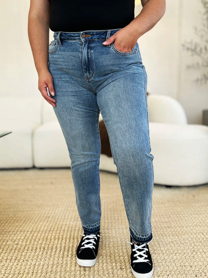 Judy Blue full size mid-rise rigid jeans with magic release hem, casual denim style, showing front view with pockets and distressed details.