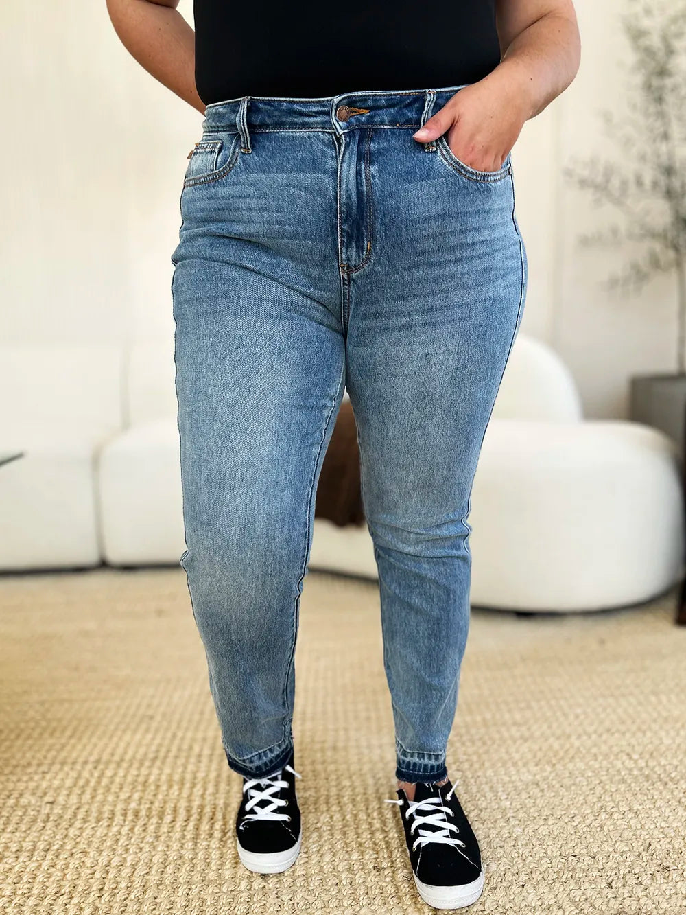 Judy Blue full size mid-rise rigid jeans with magic release hem and classic denim look, shown on a model.