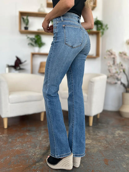 Full view of Judy Blue mid-rise waist straight jeans in medium wash, showcasing classic denim style and fit.
