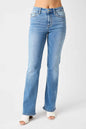 Medium wash Judy Blue full-size mid-rise waist straight jeans displayed on a model, showcasing classic fit and denim texture.