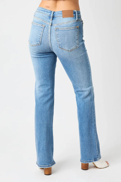 Medium wash Judy Blue full-size mid-rise waist straight jeans, shown on a model, with classic five-pocket design.