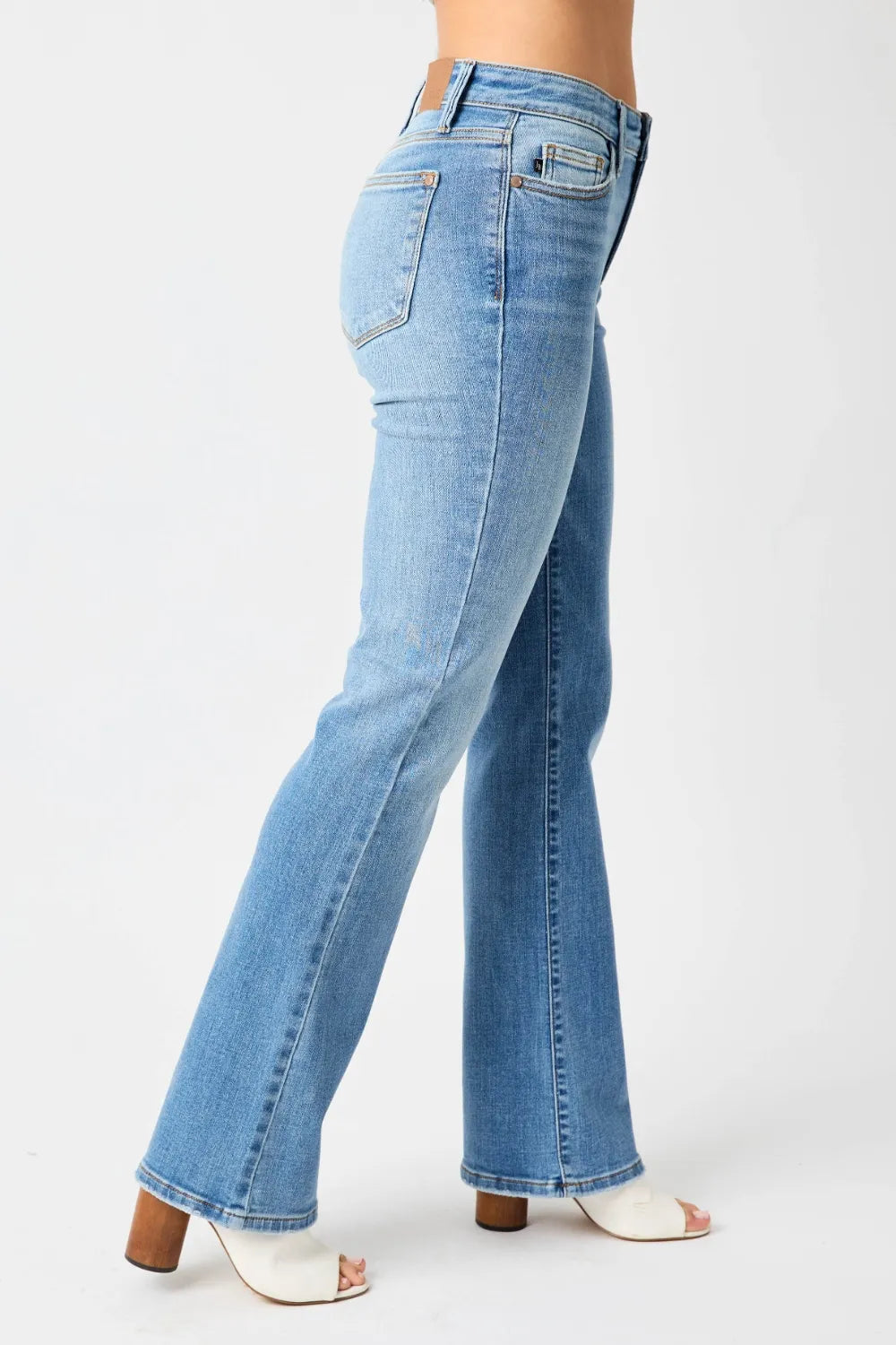 Full view of Judy Blue mid-rise waist straight jeans in medium wash, showcasing classic denim style and fit.