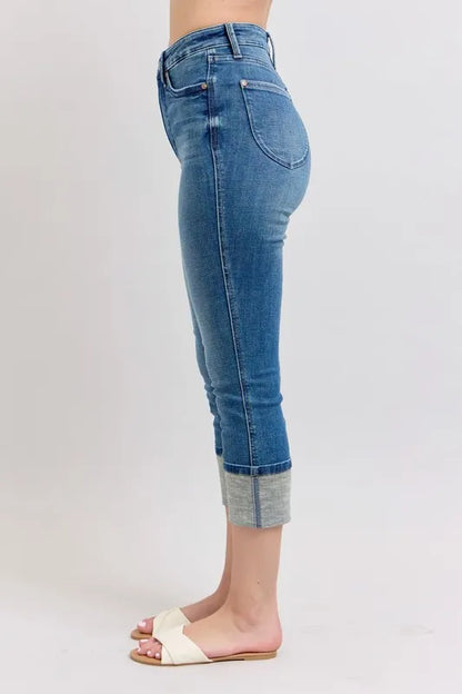 Plus size Judy Blue skinny cuff capris jeans with pockets, featuring a full-length fit and trendy style.