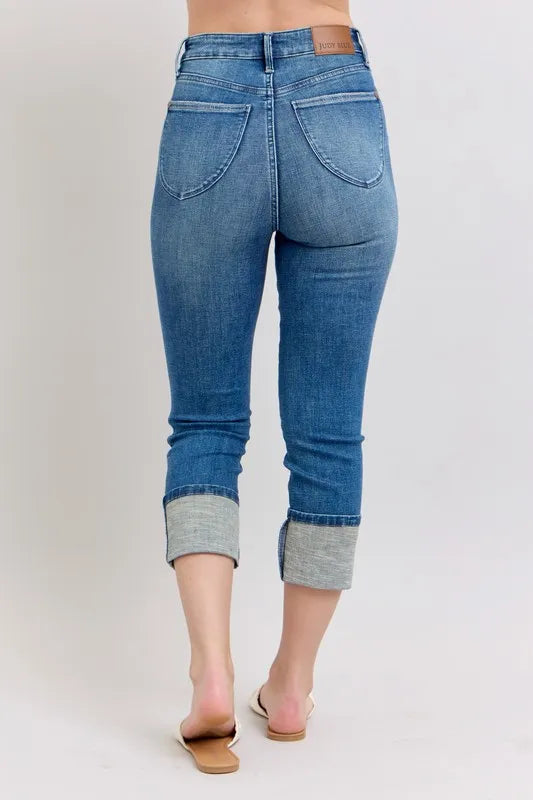 Plus size Judy Blue skinny cuff capris jeans with pockets, full-length denim pants in a casual style.