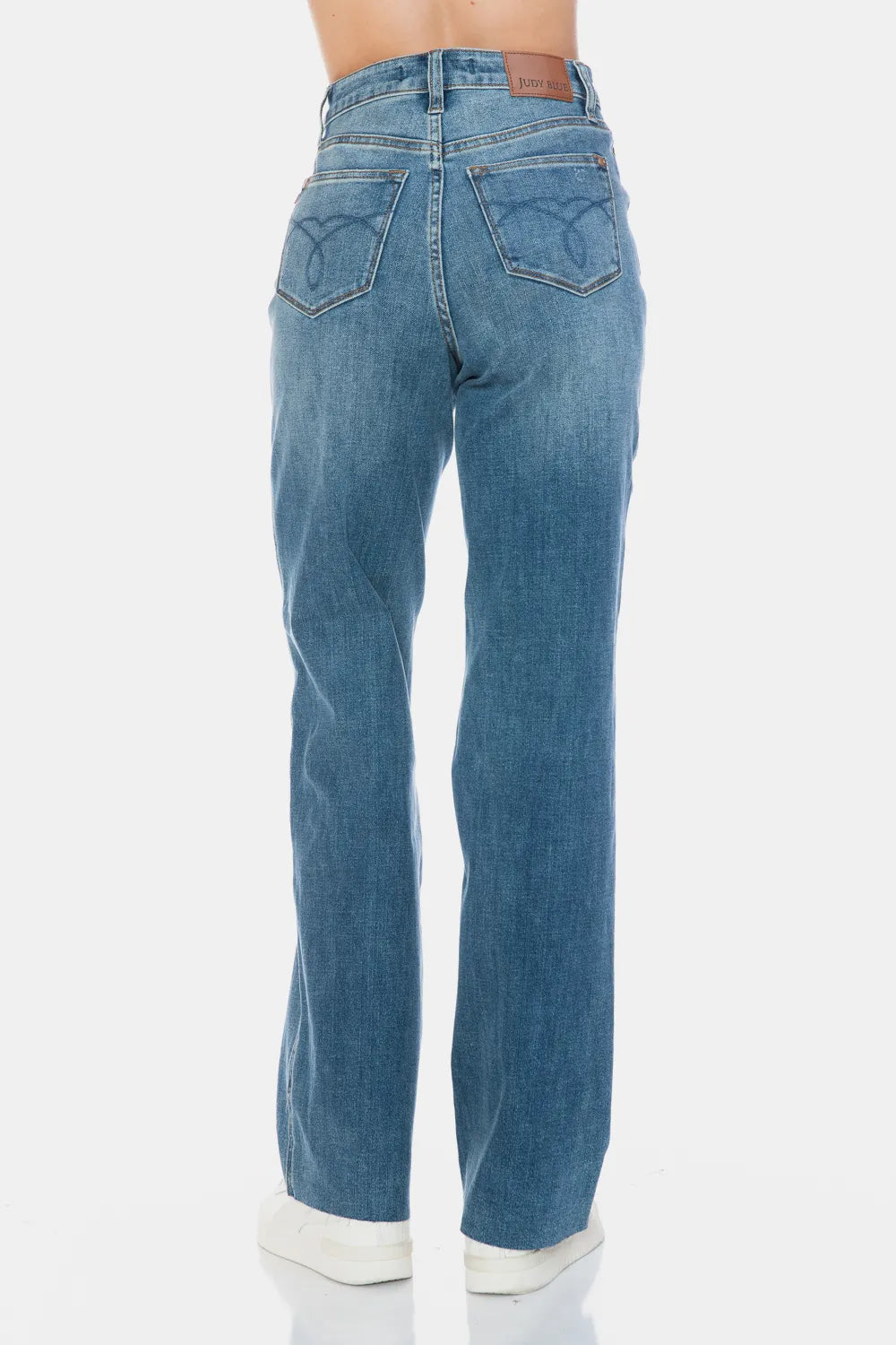 Judy Blue full size tummy control straight jeans with raw hem, featuring a classic fit and distressed detailing.