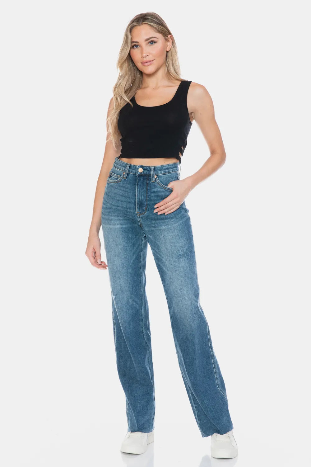 Judy Blue full size tummy control straight jeans with cut raw hem, displayed on a model showcasing fit and style.