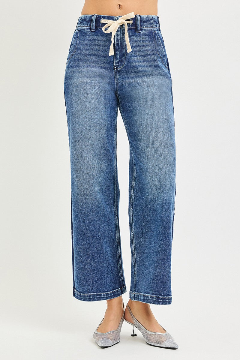 High-rise cropped wide jeans with elastic band from RISEN by Trendsi, showing the relaxed fit and stylish denim fabric.