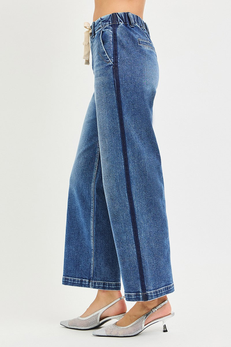 Trendsi RISEN high-rise cropped wide jeans with elastic band, showcasing their relaxed fit and stylish denim design.