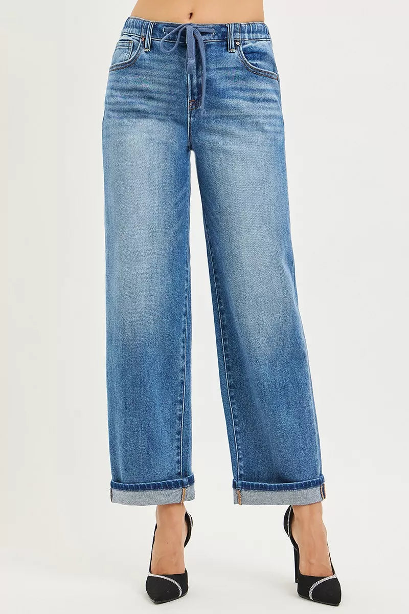 Risen elastic band slouch ankle boyfriend jeans with cuffed hem, shown on a model, in a casual denim style.