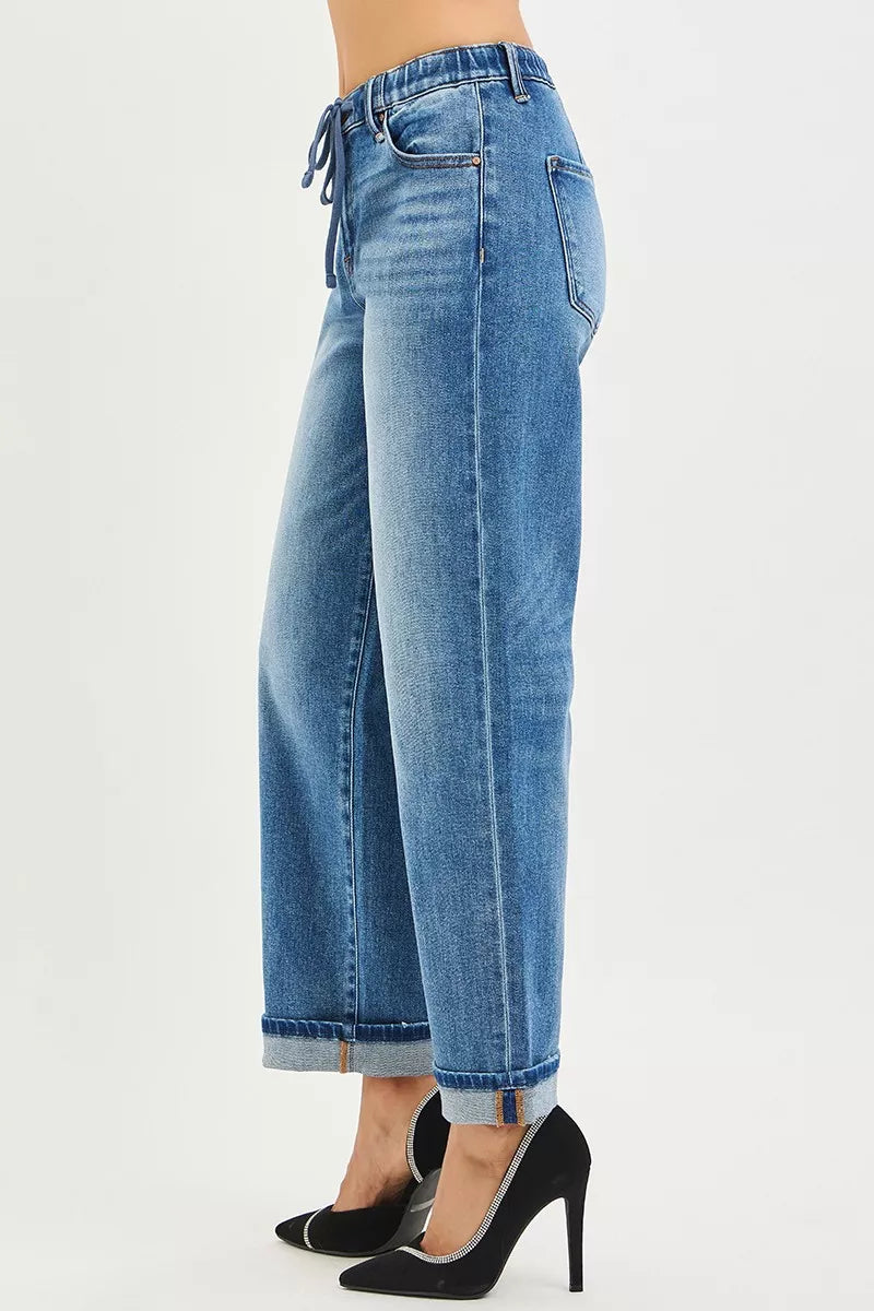 Risen elastic band slouch ankle boyfriend jeans with cuffed hem, casual fit, in light denim, worn by a model.