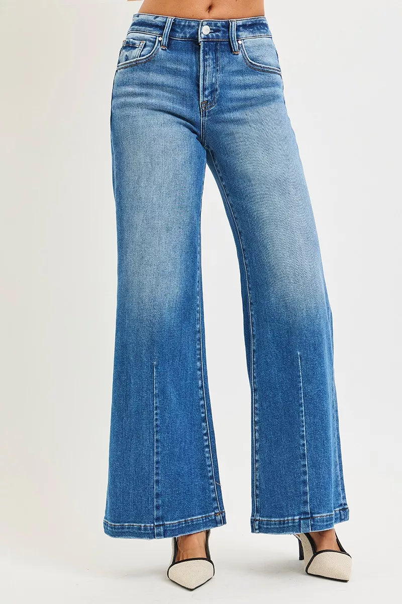 Plus size RISEN full size mid-rise wide-leg jeans with flared look, featuring a trendy relaxed fit and stylish design.