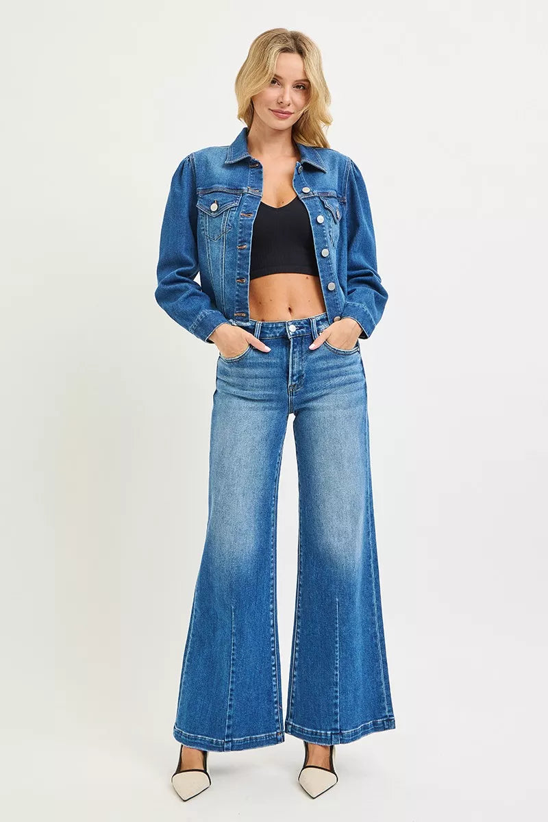 Plus size RISEN full size mid-rise wide leg jeans with flared look, shown from a front view, by Trendsi.