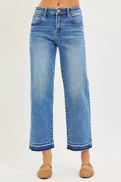Plus size Risen boyfriend jeans with a slouchy, cropped fit, featuring a relaxed, casual denim look.