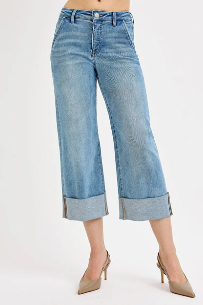 Plus size RISEN high-rise ankle wide-cuffed jeans with tummy control, made by Trendsi, shown with a fitted waist and cuffed hems.