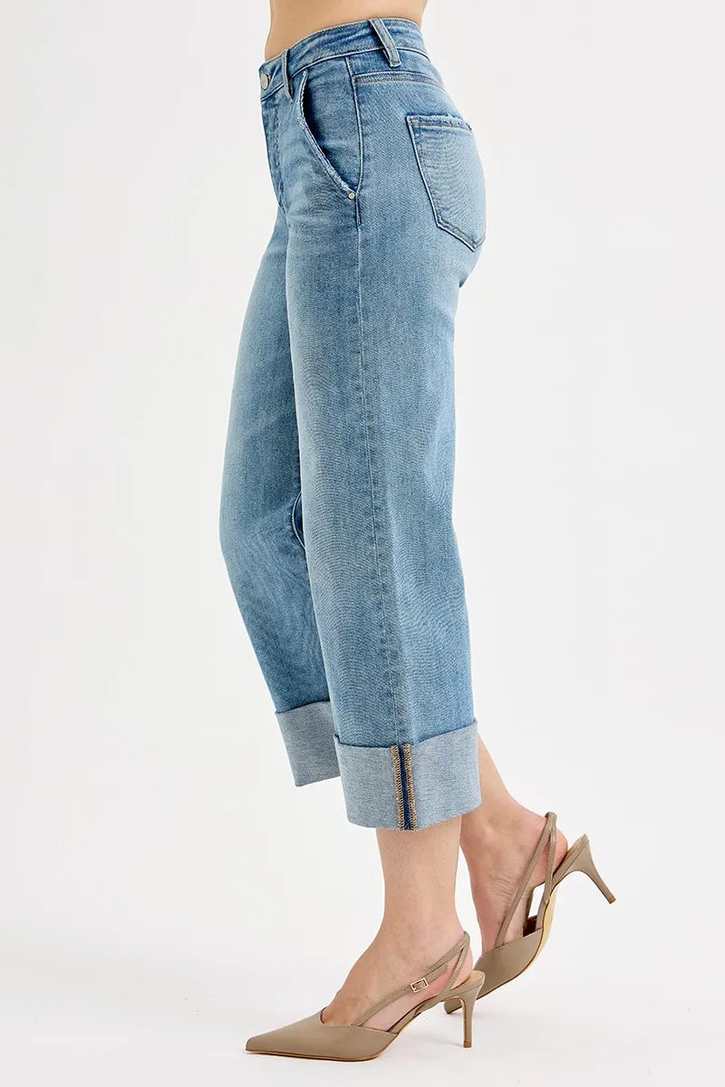 Plus size Trendsi RISEN high-rise ankle wide cuff jeans with tummy control, showcasing the denim fabric and cuffed ankle design.