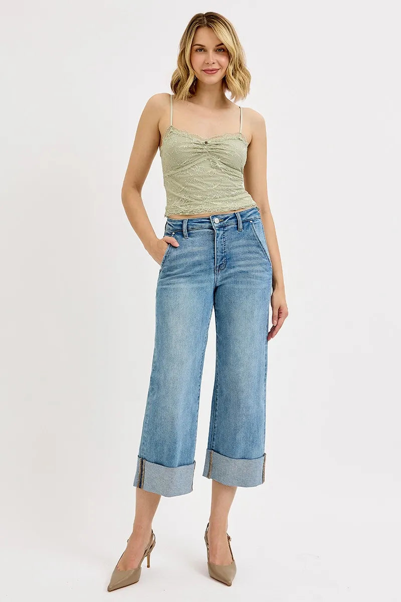 Plus size high-rise ankle jeans with wide cuffs from RISEN by Trendsi, featuring tummy control and a fitted silhouette.