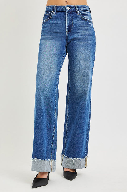 Light blue Risen high-rise wide-leg jeans with cuffed hem, showcasing relaxed fit and stylish design.